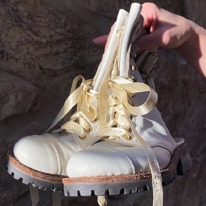 Jeffrey Campbell heelless Cream combat boots.